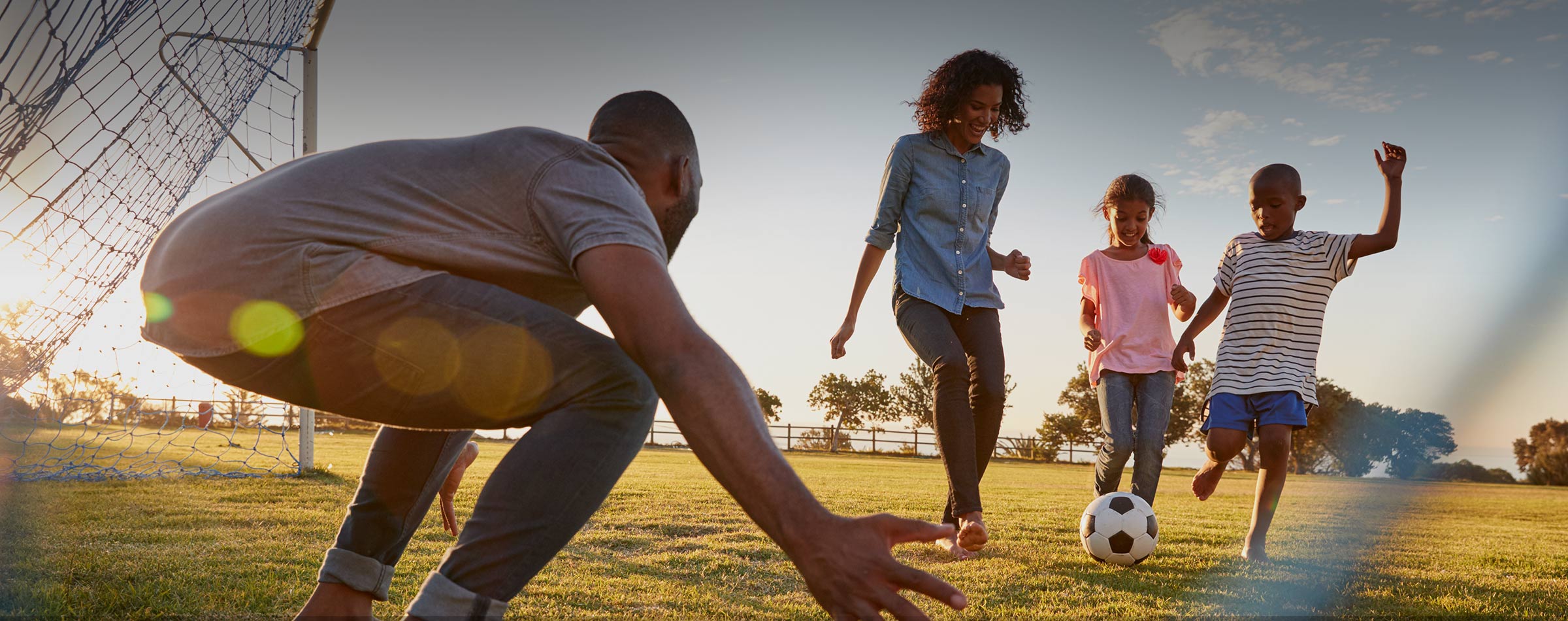 Family playing on field